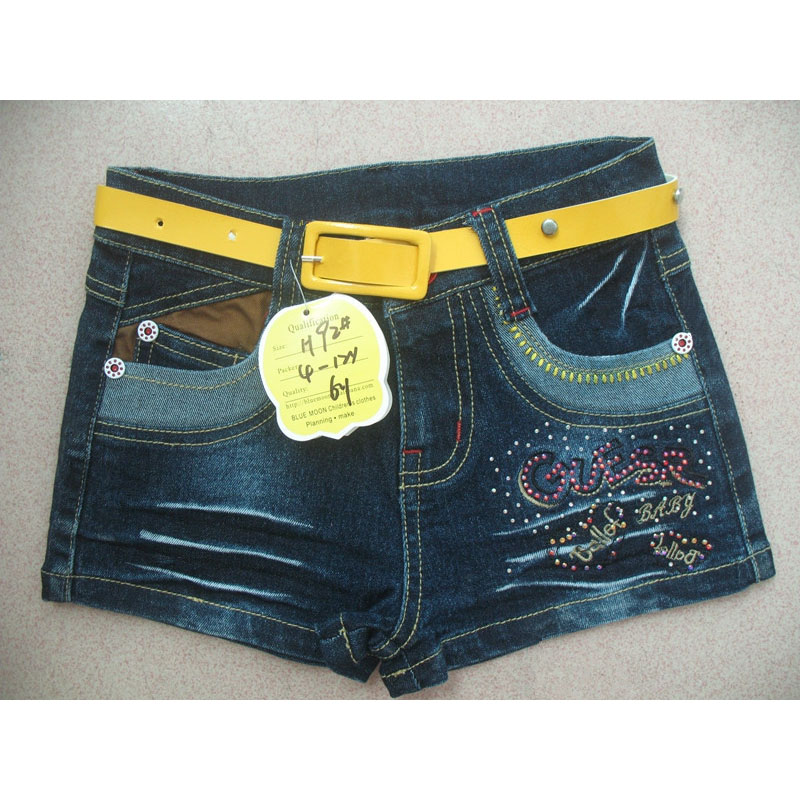 Girls short denim jeans, blue shorts with wirinkles and yellow belt
