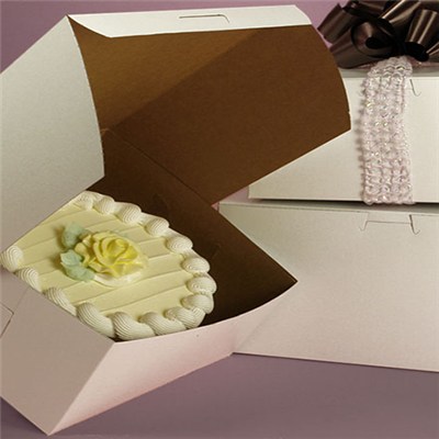 Standard white cake boxes with mostly kraft interiors
