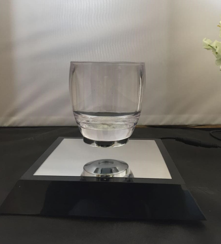 Trapezoidal base magnetic levitation floating water cup