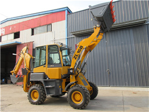 Mini backhoe loader with hydraulic hammer attachments