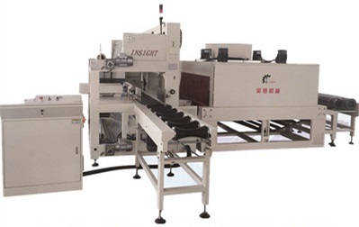 Automatic shrink film packaging machine