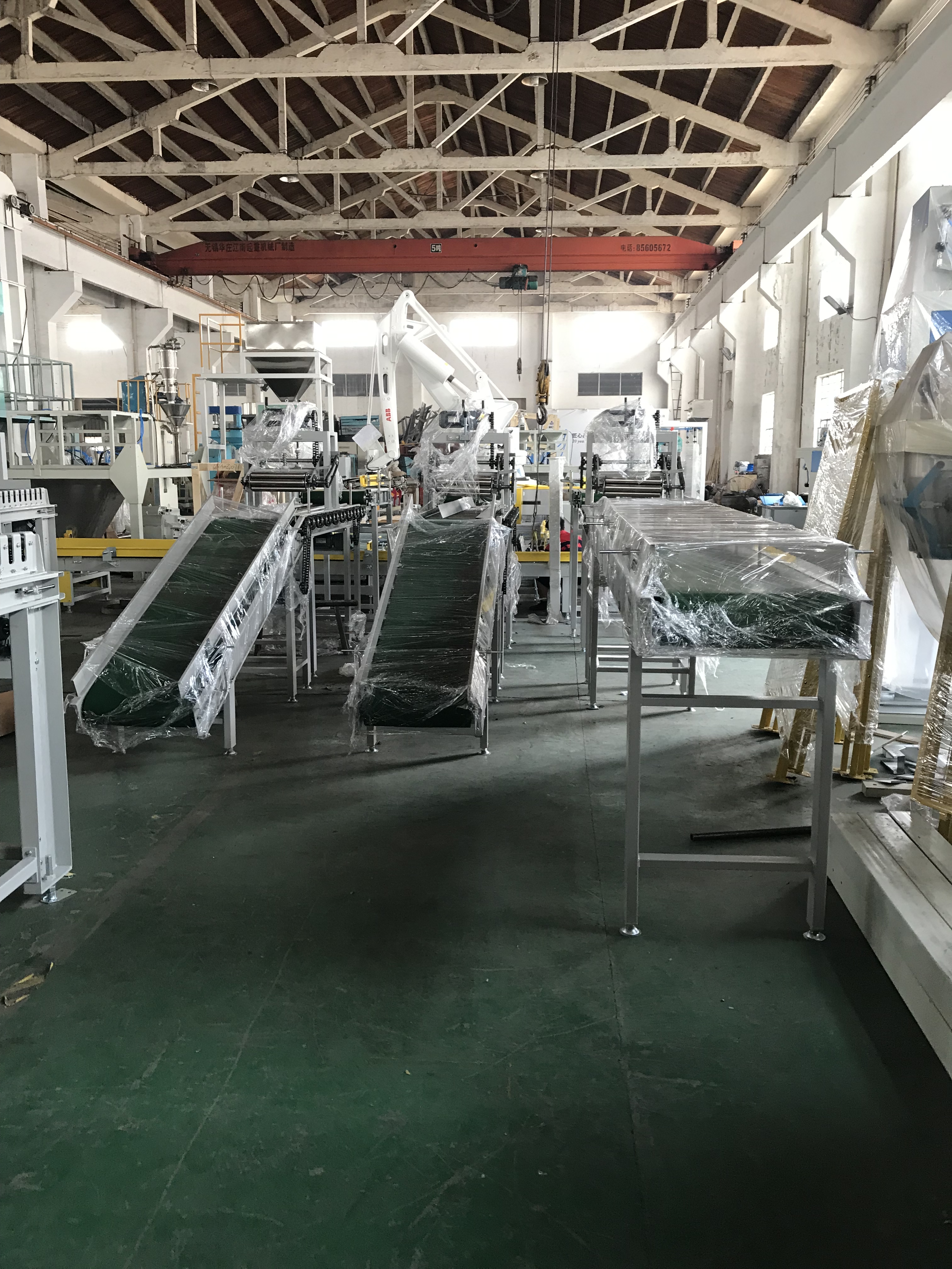 automated bagging machine 无锡航一机械有限公司 Automatic Bagging Line Fully Automatic Packing Palletizing Line 无锡航一机械有限公司  全自动定量包装秤系统机器人包装码垛线