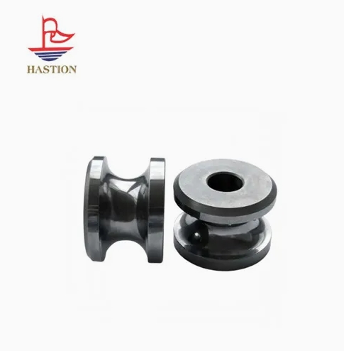 Titanium carbide guide wheels for cable armor processing